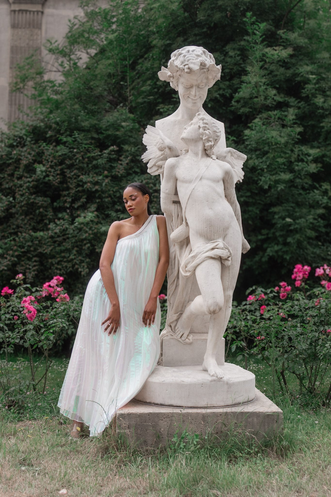 Elegant woman near statue